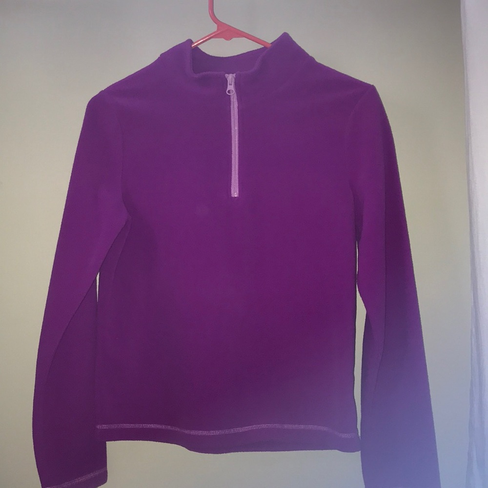 A purple coat with a pink zipper. (Worn once)